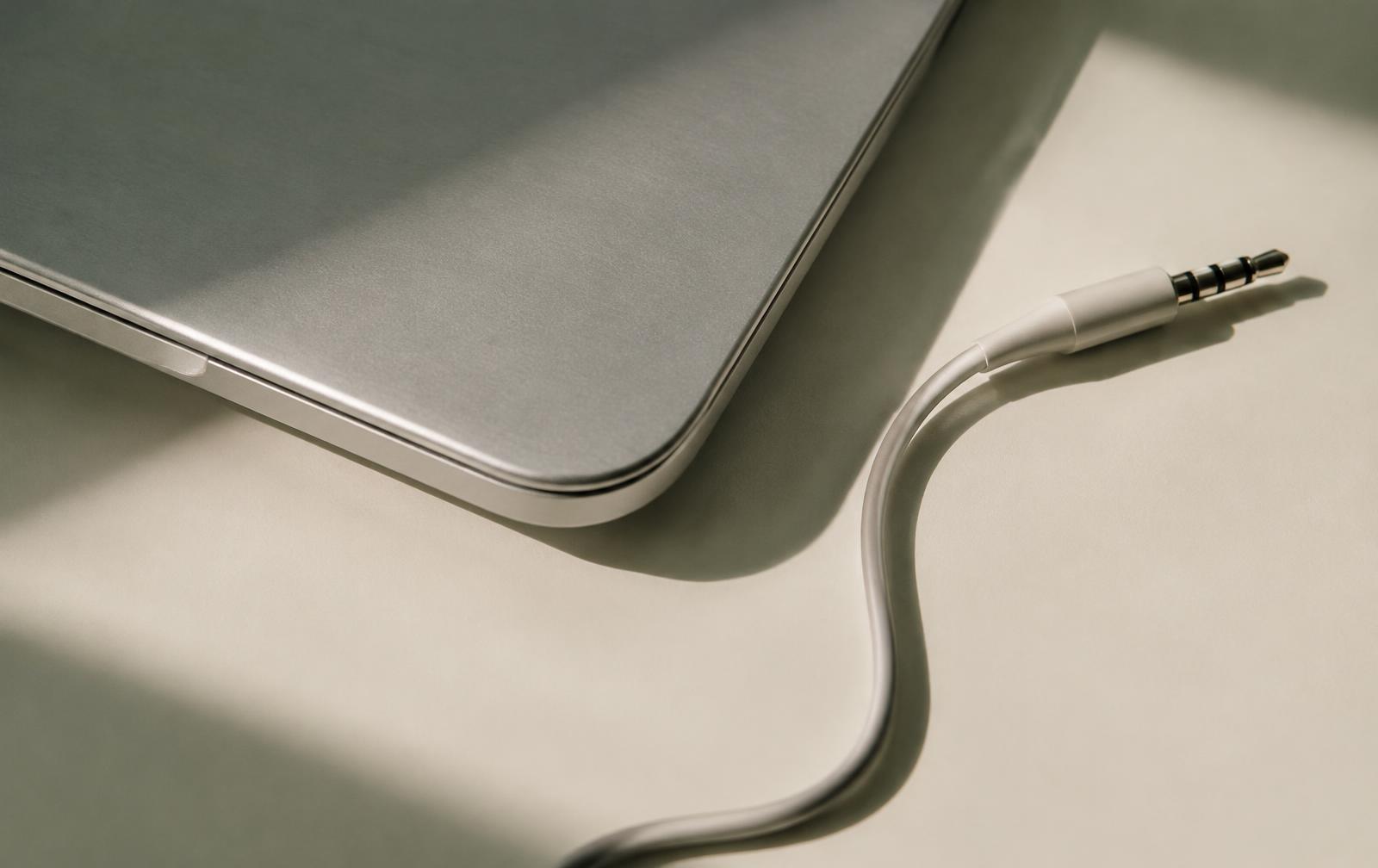 Detail of a laptop edge and audio cable
